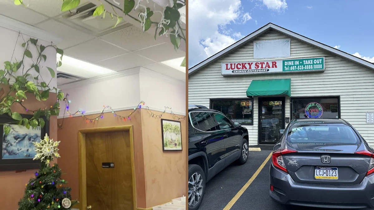 A simple storefront with parking nearby.